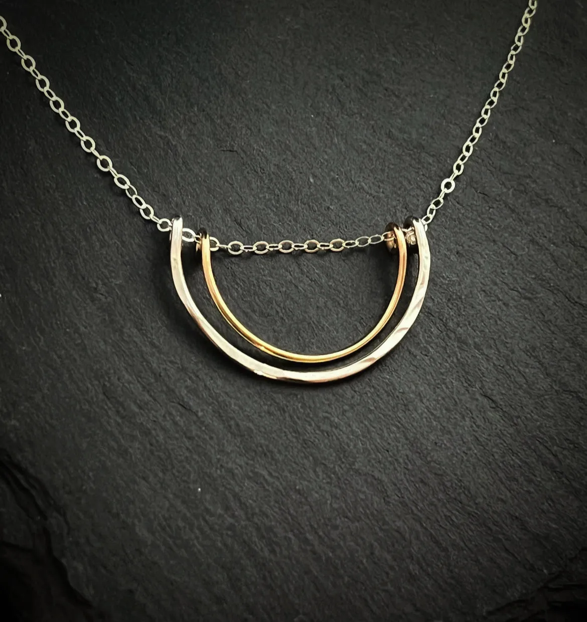Forged sterling silver and 14 karat gold wire half moon necklace
